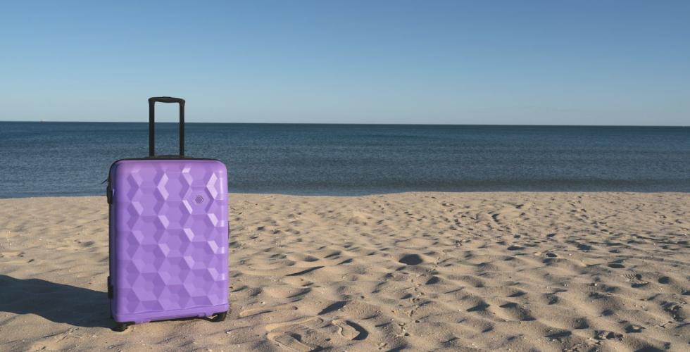 Koffert på sandstrand